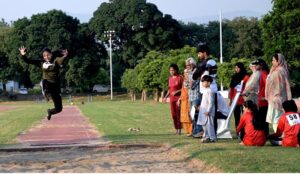 A student in action during the 3-day 'Girls Sports Carnival 2024,' organized by the Ministry of Federal Education and Professional Training at Pakistan Sports Complex.