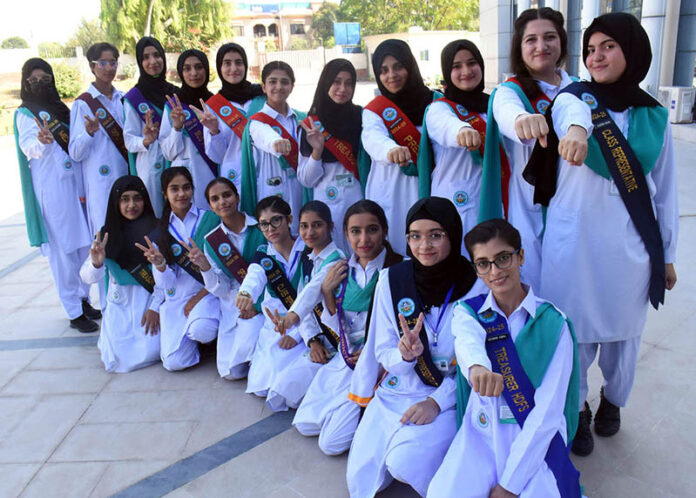 Students pose for group photograph after oath taking ceremony of Newly elected officials of students council at FG Home economics and management sciences college F11