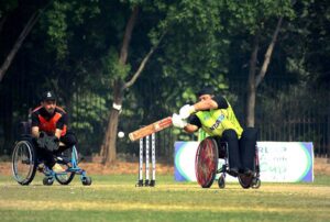 Players in action during the wheelchair cricket match between Sindh and Khyber Pakhtunkhwa teams for the Interloop Quaid-e-Azam T-20 Cup Wheelchair Cricket 2024 at Bohran Wali Ground
