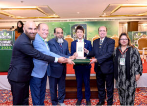 Deputy Head of Malaysian High Commission Mohammad Sayafik Firdaus giving away "Leaders in Sustainability Awards" to the sustainable development champions, organized by Devcom-Pakistan