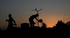 CDA staffers work on beautification of the city during sunset time at Zeropoint Interchange.
