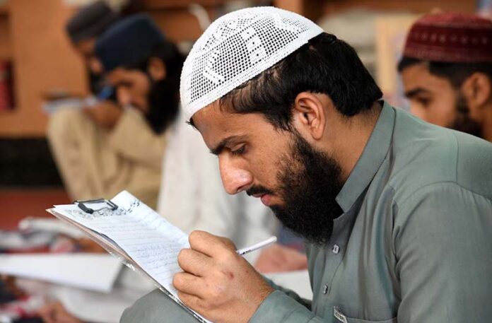 Madrassa students are busy giving annual exam at Jamia Ishatul Quran Wal Hadith Dodai Road in the City