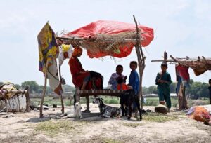 The lens captures the essence of a Gypsy family's life in their hut near Bakrani Road in the city.