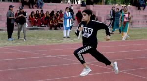 A student in action during the 3-day 'Girls Sports Carnival 2024,' organized by the Ministry of Federal Education and Professional Training at Pakistan Sports Complex.