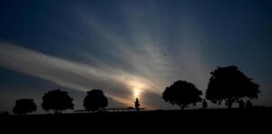 A breathtaking view of the sunset casting its warm hues over the Federal Capital.