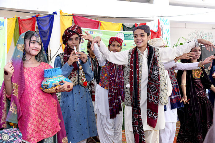 Students are performing during a function at Govt Girls High School Little Folks Jinnah Bagh