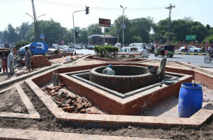 The construction work is going on the green belt at GPO Chowk in front of the High Court.