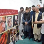 The former President and Prime Minister of Azad Jammu and Kashmir (AJK) Sardar Mohammed Yaqoob Khan with other participants viewing pictorial exhibition on the occasion of Kashmir Black Day at Arts Council of Pakistan
