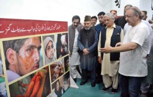 The former President and Prime Minister of Azad Jammu and Kashmir (AJK) Sardar Mohammed Yaqoob Khan with other participants viewing pictorial exhibition on the occasion of Kashmir Black Day at Arts Council of Pakistan