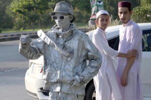 Youngsters keenly looking at the Silverman standing on the Faisal Avenue to earn for livelihood.
