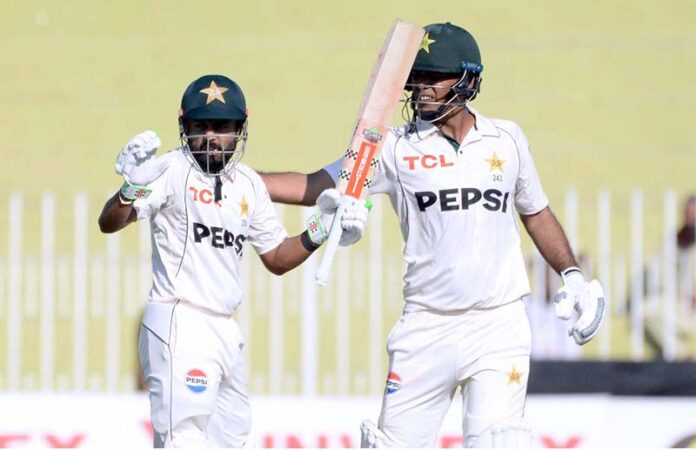 Pakistan player Saud Shakeel celebrates after scoring a century (100 runs) during the second day and last cricket Test match between Pakistan and England Pindi Cricket Stadium in twin cities
