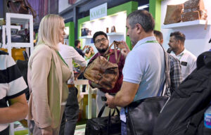 A foreign delegate shows keen interest in leather products during the second day of the 5th International Textile and Leather Exhibition (TEXPO 2024) at the Expo Center in provincial capital