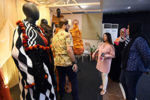 Visitors explore stalls at TEXPO 2024, showcasing the best in textiles and leather at Expo Centre