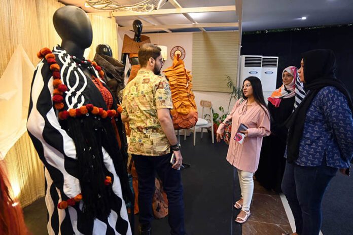 Visitors explore stalls at TEXPO 2024, showcasing the best in textiles and leather at Expo Centre