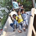 Children enjoy on slide in a local park in Federal Capital