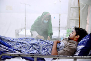 Dengue patients receive treatment in a ward at Bhitai Hospital as the Pakistan Meteorological Department warns of a 'critical' two weeks ahead due to a surge in infections across the country