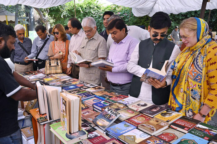 Chairman PEMRA Muhammad Salim Baig visiting the stall during the book fair at the Press Club