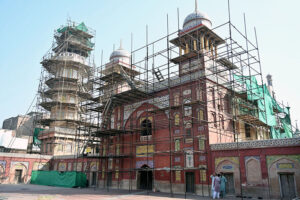 Labourers busy in renovation work to the historical Mosque Masjid Wazir Khan at Walled city. The Wazir Khan Mosque is 17th century. The mosque was commissioned during the reign of the Mughal Emperor Shah Jahan as part of an ensemble of buildings that also included the nearby Shahi Hammam baths. Construction of Wazir Khan Mosque began in 1634 C.E. and completed in 1641