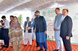 Chaudhry Salik Hussain, Federal Minister for Overseas Pakistanis and Human Resource Development addressing a cheque distribution ceremony to disburse marriage and death grants to industrial workers.
