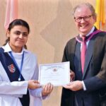 Mr. David Dowdles, Principal of Sadiq Public School,giving certificates and trophies to students who excelled in the annual Urdu debate program at the school in the city