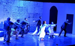 Artists performing theatre play Slaver: Aaj Ki Taza Khabar- dark comedy, directed by Younas Khan and written by Nasir Saleem during the 7th day of the World Culture Festival Karachi 2024 at Arts Council of Pakistan Karachi.