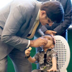 Sindh Chief Minister, Syed Murad Ali Shan administers Polio drops to a child in observance of world Polio Day