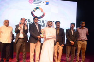 The Chief Minister Syed Murad Ali Shah giving away award to a diplomat during the award distribution ceremony under the World Culture Festival Karachi at Arts Council of Pakistan