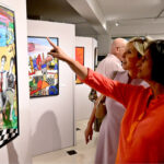Art enthusiasts admire the beautiful works at the 'Through The Veil of Dreams' painting exhibition by artist Tabinda Chinoy at Gallery 6 in Federal Capital