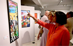 Art enthusiasts admire the beautiful works at the 'Through The Veil of Dreams' painting exhibition by artist Tabinda Chinoy at Gallery 6 in Federal Capital