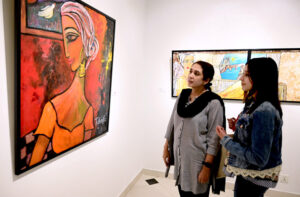 Art enthusiasts admire the beautiful works at the 'Through The Veil of Dreams' painting exhibition by artist Tabinda Chinoy at Gallery 6 in Federal Capital