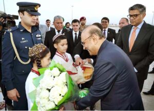 President, Asif Ali Zardari being presented with traditional bread and flowers upon his arrival at Ashgabat Airport.