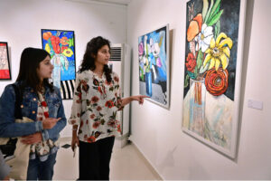 Art enthusiasts admire the beautiful works at the 'Through The Veil of Dreams' painting exhibition by artist Tabinda Chinoy at Gallery 6 in Federal Capital