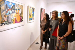 Art enthusiasts admire the beautiful works at the 'Through The Veil of Dreams' painting exhibition by artist Tabinda Chinoy at Gallery 6 in Federal Capital
