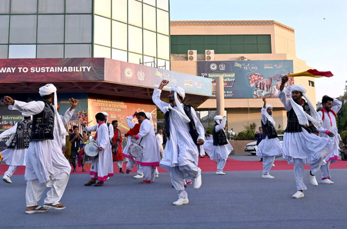 Artists perform traditional folk dances on the closing day of the 5th International Textile and Leather Exhibition, TEXPO 2024, at the Expo Center