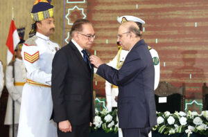 President Asif Ali Zardari conferring the award of Nishan-e-Pakistan upon the Prime Minister of Malaysia, Dato Seri Anwar Ibrahim, during a special investiture ceremony at Aiwan-e-Sadr.
