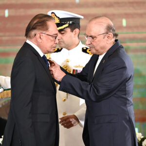 President Asif Ali Zardari conferring the award of Nishan-e-Pakistan upon the Prime Minister of Malaysia, Dato Seri Anwar Ibrahim, during a special investiture ceremony at Aiwan-e-Sadr.