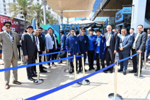 Ambassador Faisal Niaz Tirmizi, Pakistan’s Envoy in UAE along with visiting delegates from Pakistan and local students visitors standing in front of monument highlighting “Tech Destination Pakistan 2024” displayed at Dubai World Trade Centre.