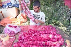 Vendors busy making flower garlands and displaying flower bouquet to attract the customers at Banni Chowk