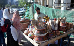 A vendor selling household items to attract customers at roadside