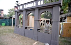 Workers are busy in installation a model of the provincial major cities for the upcoming Folk Festival "Lok Mela 2024" at Lok Versa in the Federal Capital.