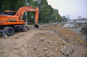A development project is underway as heavy machinery is being used in the construction work at the PTCL Chowk Underpass, aimed at improving traffic flow and infrastructure in the heart of the Federal Capital.