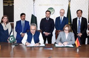 Secretary Economic Affairs Dr. Kazim Niaz and Director of the German Development Bank (KFW)Esther Gravenkotter signing the second phase of Billion Tree Afforestation project