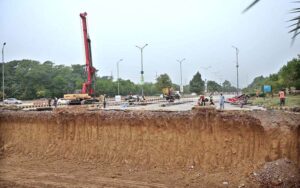 A development project is underway as heavy machinery is being used in the construction work at the PTCL Chowk Underpass, aimed at improving traffic flow and infrastructure in the heart of the Federal Capital.