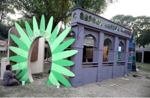 Workers are busy in installation a model of the provincial major cities for the upcoming Folk Festival "Lok Mela 2024" at Lok Versa in the Federal Capital.