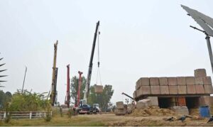 A development project is underway as heavy machinery is being used in the construction work at the PTCL Chowk Underpass, aimed at improving traffic flow and infrastructure in the heart of the Federal Capital.