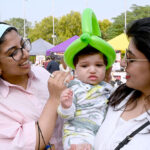 A family in happy mood during visiting the Behbud Art and Craft Bazar 9-10 November at PAK CHINA Friendship center