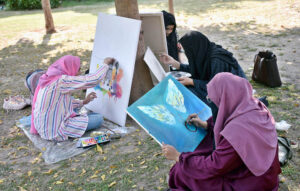 Students participating in Art Work Competition organised by The Knowledge of Art Academy in collaboration with The Book Studio, NCBA University, University of Education and Birmingham University UK at University of Education Township Lahore.