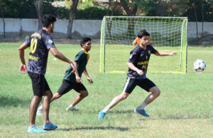 Players in action during a thrilling futsal match between Markhor Academy and Public School in the 4th Hyderabad Students Olympic Games 2024, at Public School.
