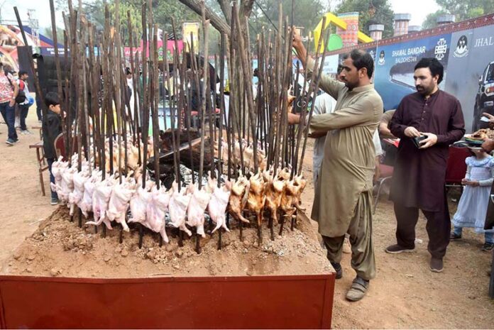 People visiting food stall during ten days “Folk Festival Lok Mela” at Lok Virsa in the Federal Capital
