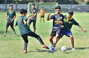 Players in action during a thrilling futsal match between Markhor Academy and Public School in the 4th Hyderabad Students Olympic Games 2024, at Public School.